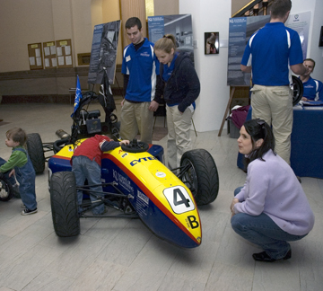 A youngster checks out the driver’s seat