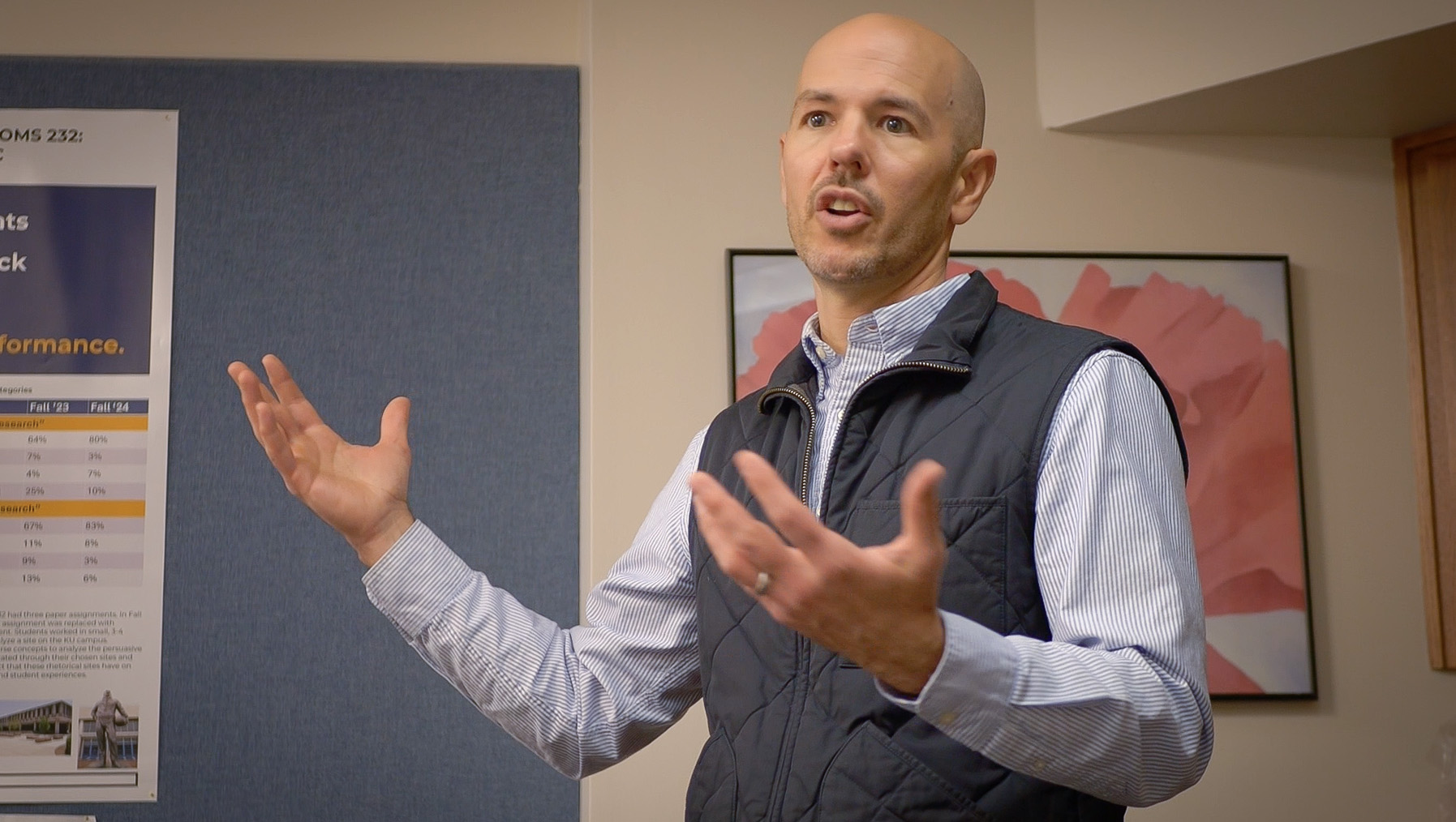 Male presenter gesturing