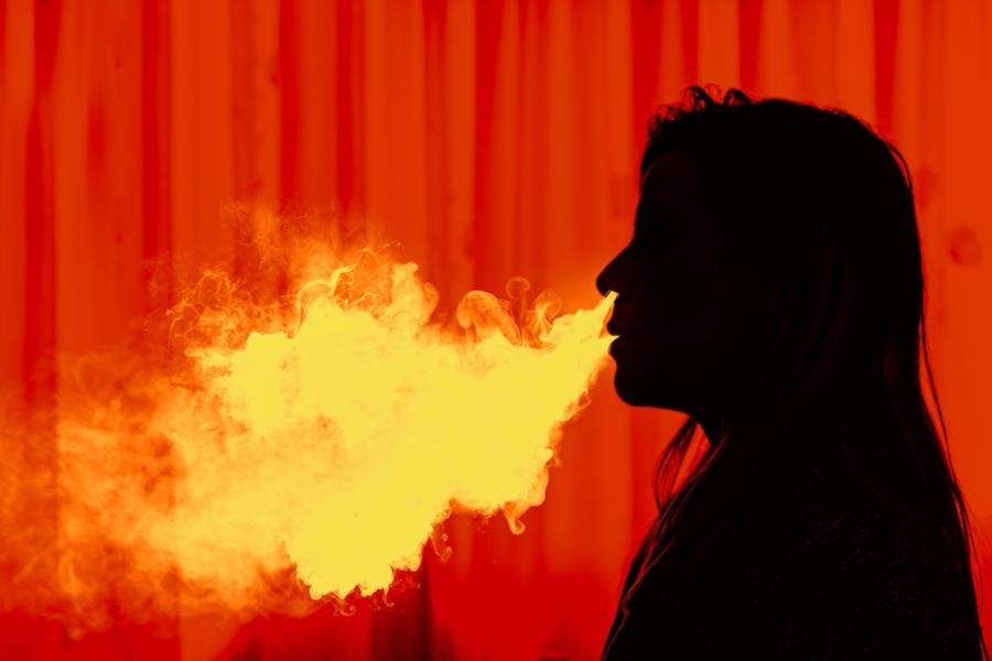 Stock photo of vapor smoke being exhaled