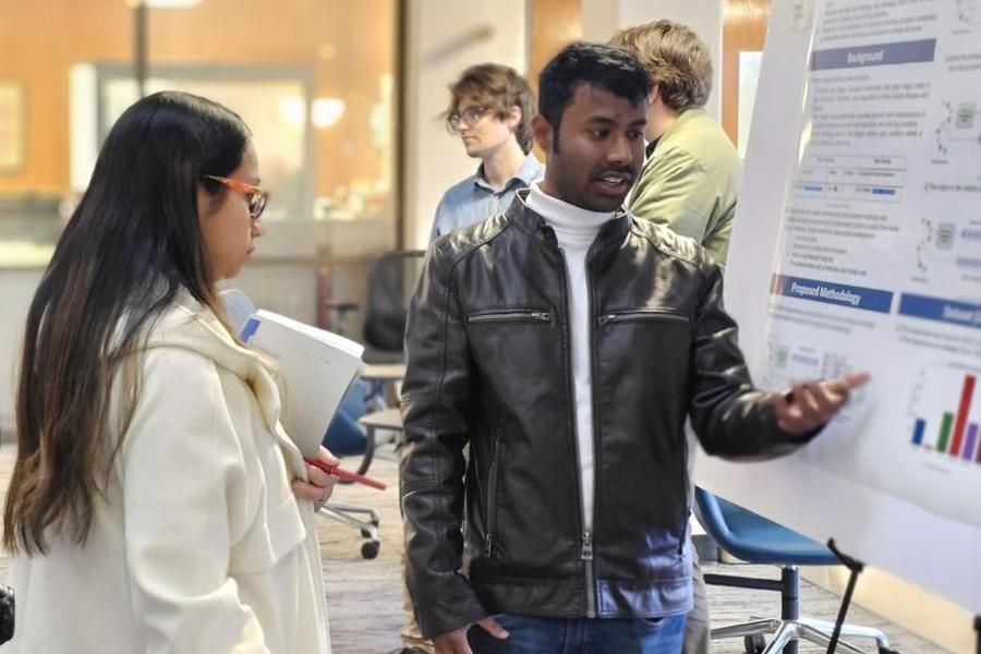 Photo of lead author Fairuz Shadmani Shishir at a poster session with his faculty advisor and coauthor Sumaiya Shomaji, assistant professor in the Department of Electrical Engineering and Computer Science at the University of Kansas.
