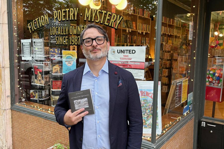 Patrizio Ceccagnoli stands outside The Raven bookstore.