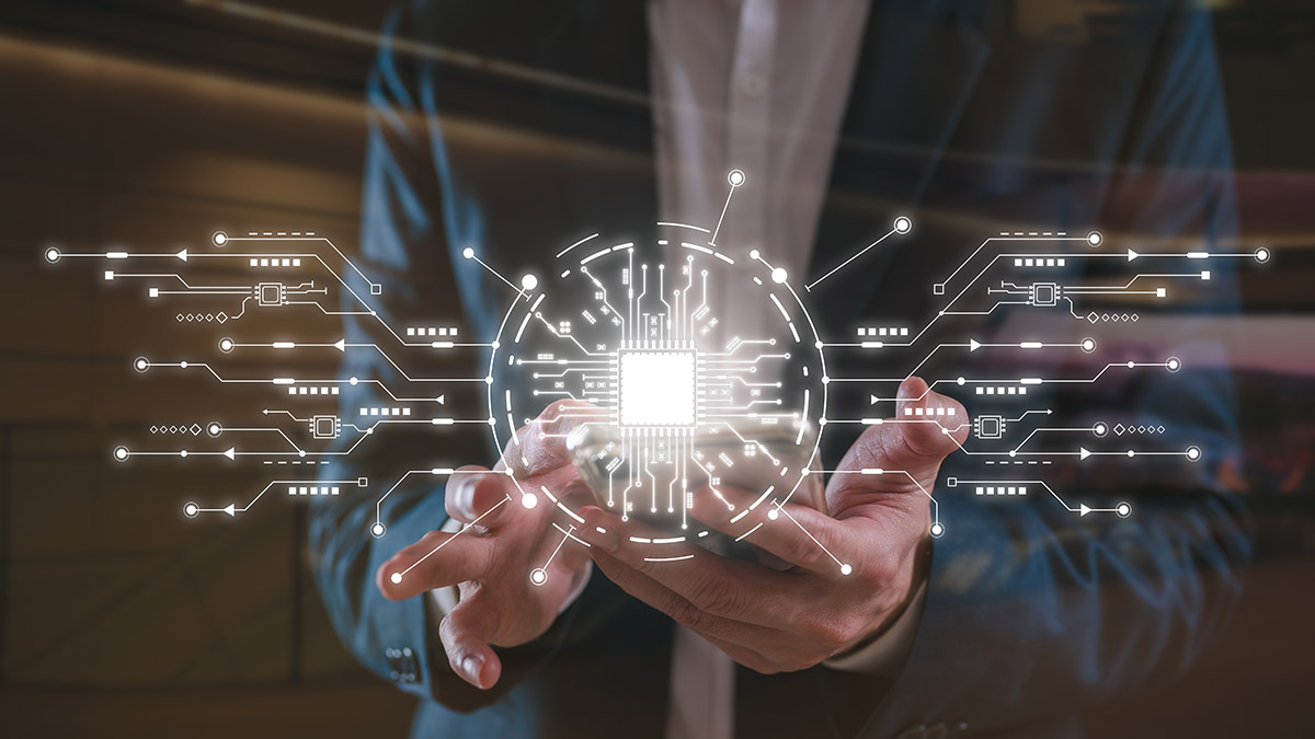 A photo illustration of someone holding a smartphone with illustrations of microchips, data, artificial intelligence and other technology surrounding it.