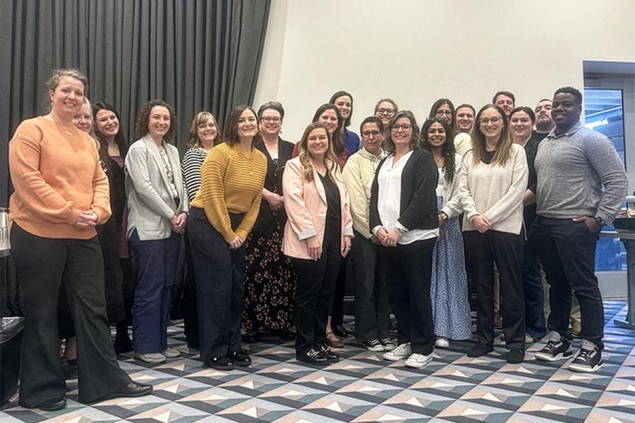 Group photo of Cohort 5 in a conference room