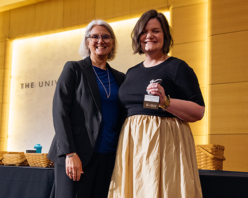 Provost Barbara Bichelmeyer presents the Employee of the Year Award to Dannah Hartley.