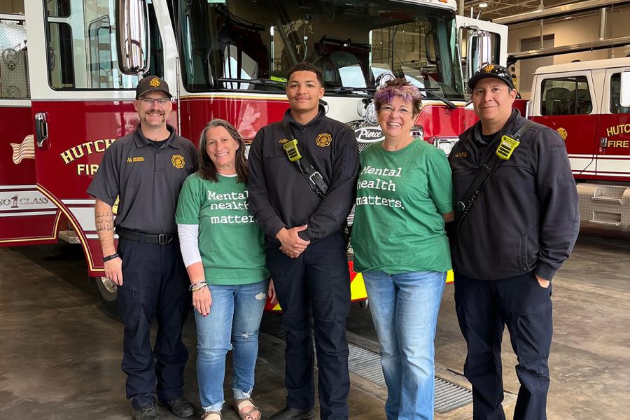 First responder trainees standing in front of a fire truck