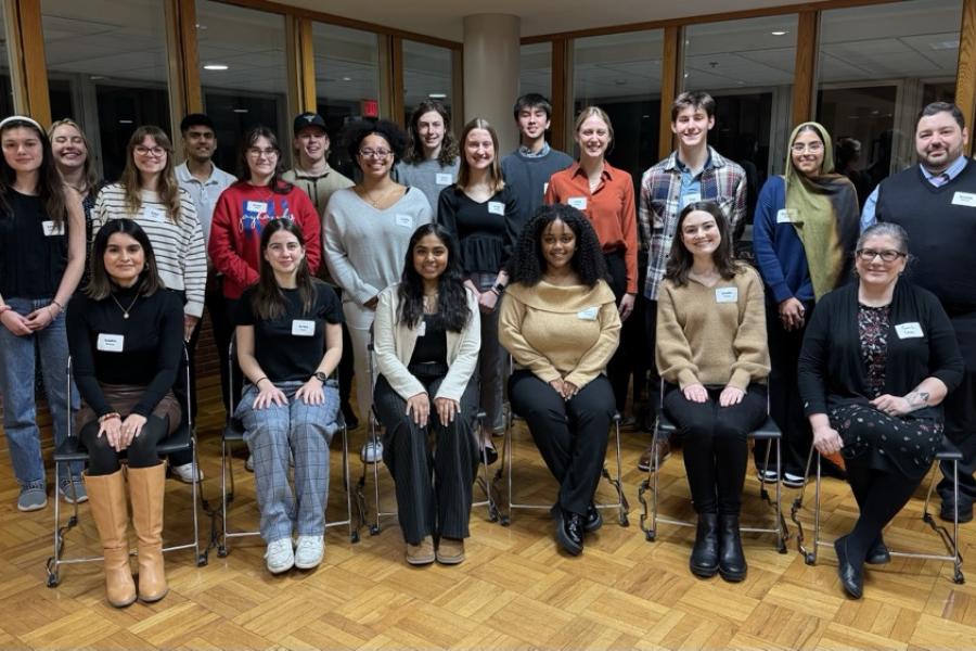 A group photo of students with their instructor