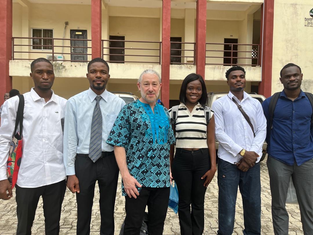 KU's Oluwaseun Sanwoolu (third from right) and Oluwakorede Ajibona (far right) at the Unibersity of Ibadan