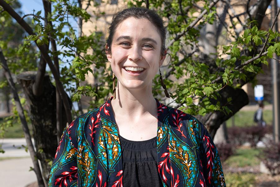 Photo of Alicia Houser in front of Strong Hall