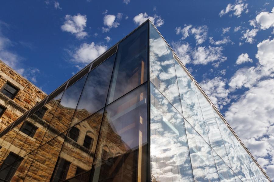 view of Marvin and Chalmers halls with clouds reflected in glass