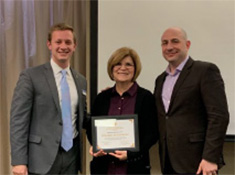 Noach Ries and Carl Lejuez presenting Ingrid Peterson with textbook award