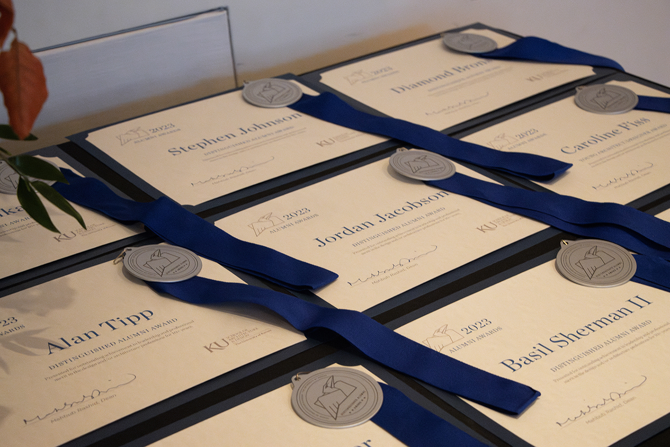 A table displaying award certificates and medals.