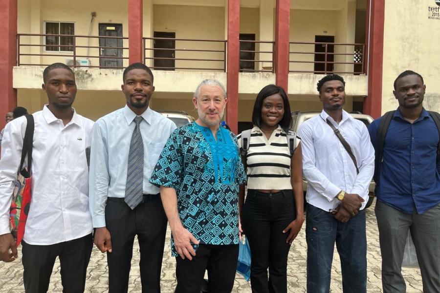 KU's Oluwaseun Sanwoolu (third from right) and Oluwakorede Ajibona (far right) at the Unibersity of Ibadan