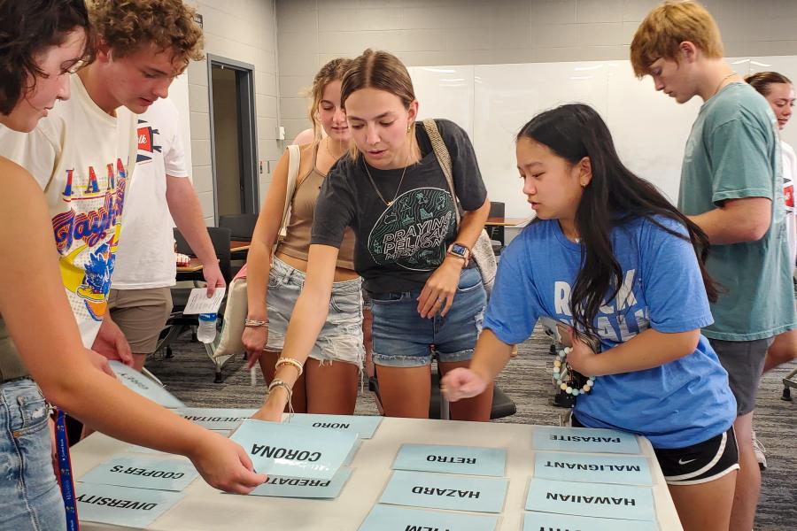 A group of students work together to solve a Connections Puzzle