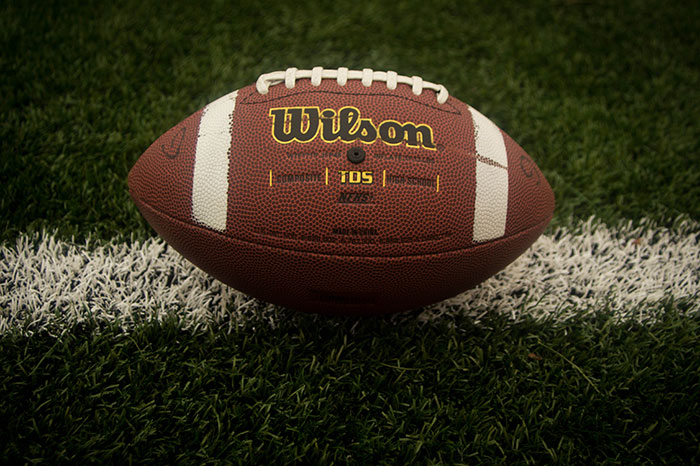 A football sits on a field