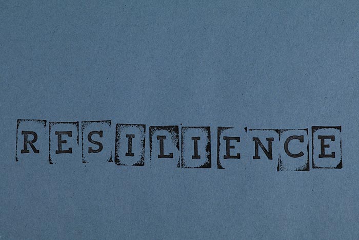 Blue sign with black type: Resilience