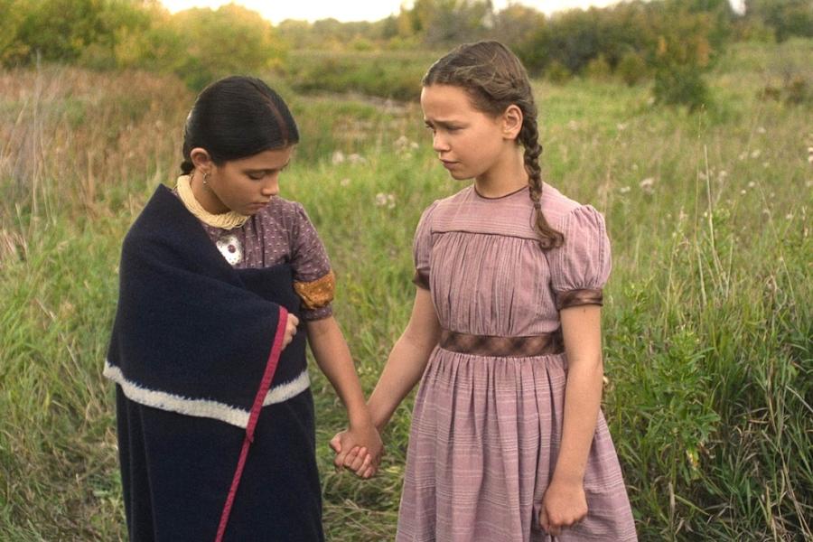 Wren Zhawenim Gotts, left, portrays Good Eagle and Alice Halsey portrays Laura Ingalls in an episode of “Little House on the Prairie.” Image credit: Netflix