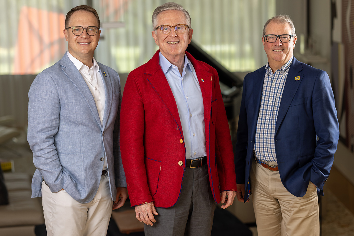 Kansas Athletics Director and Vice Chancellor Travis Goff, KU alumnus and donor David G. Booth and KU Chancellor Douglas A. Girod