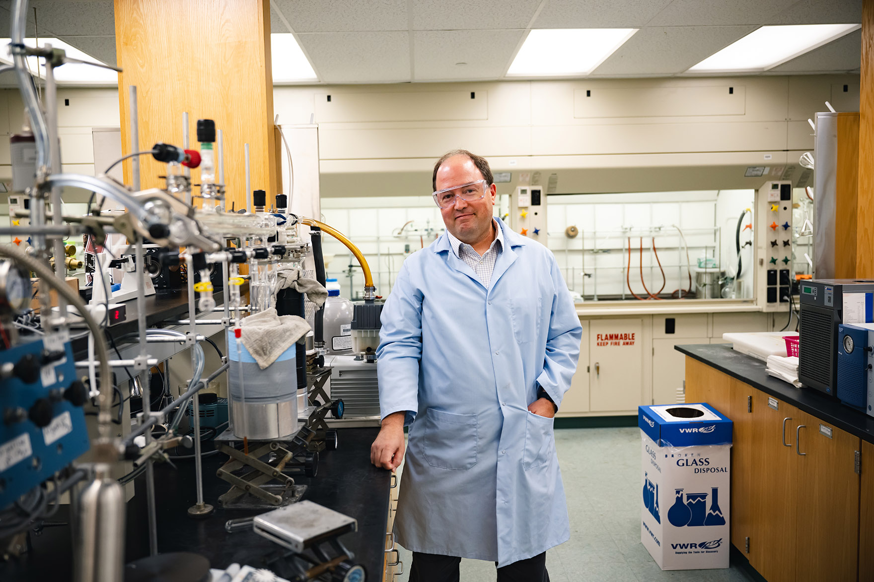 David Vicic wearing goggles in a chemistry lab