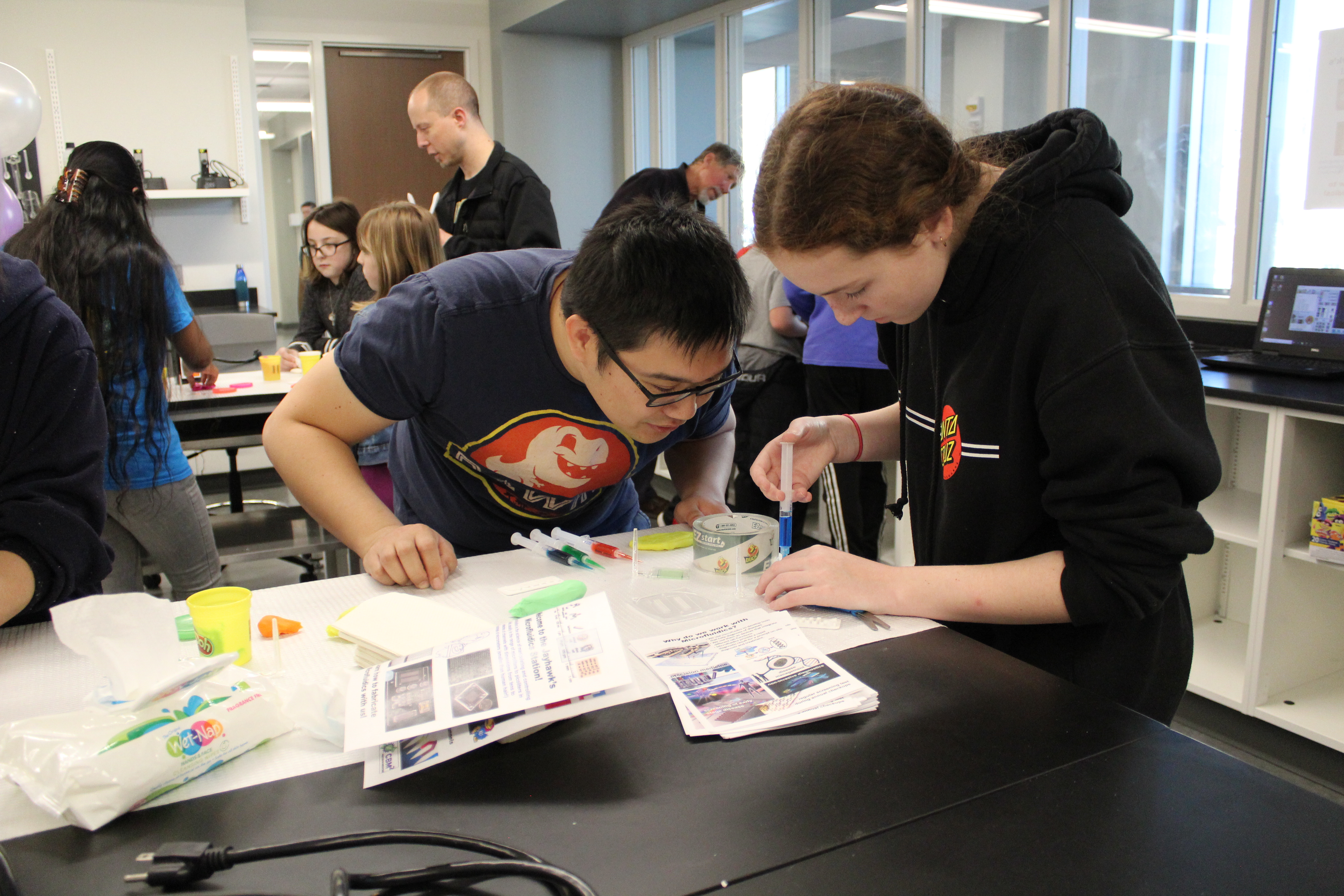 Two students engrossed in a craft project.