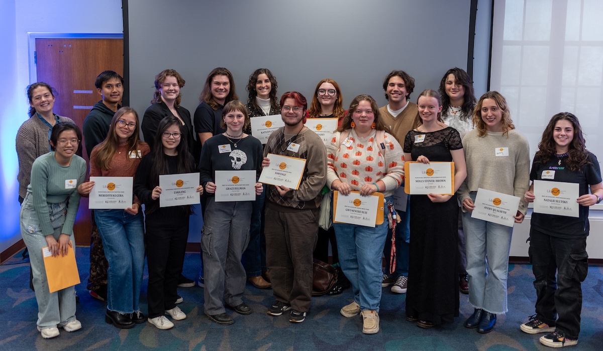 Award winners pose with their certificates at the 2025 LibArt Reception in Watson Library. Selected students from all majors have work exhibited inside the libraries’ public spaces during the annual showcase