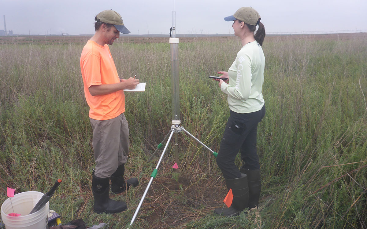 KGS researchers take soil infiltration measurements.