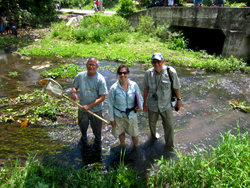 From left are Don Huggins and Debbie Baker in Haiti with Gary Welker, once Huggins' student..