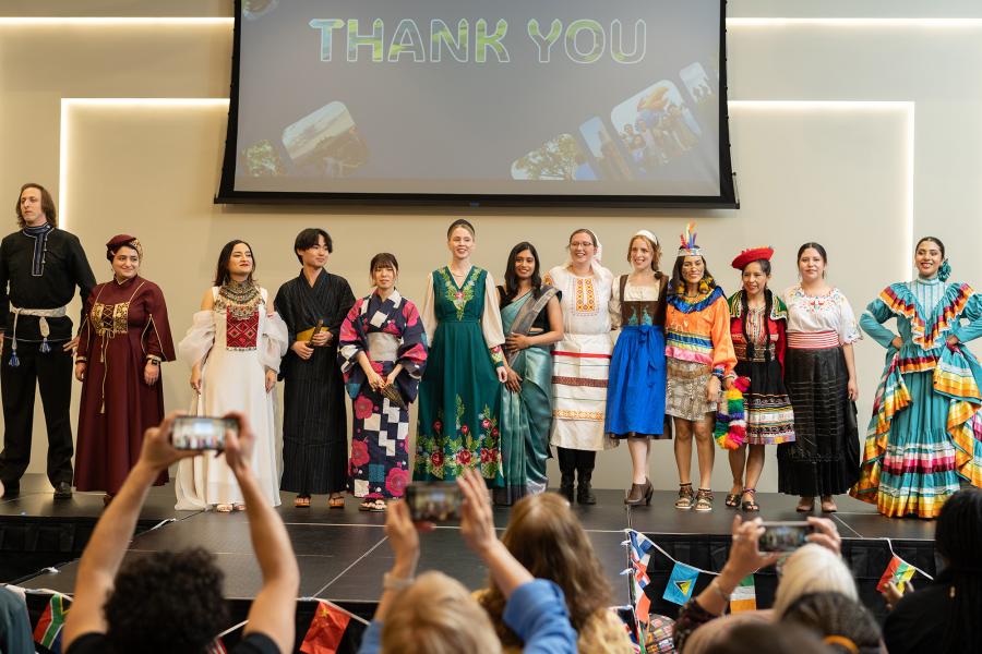 Students dressed in national costumes at International Jayhawk Festival 2025