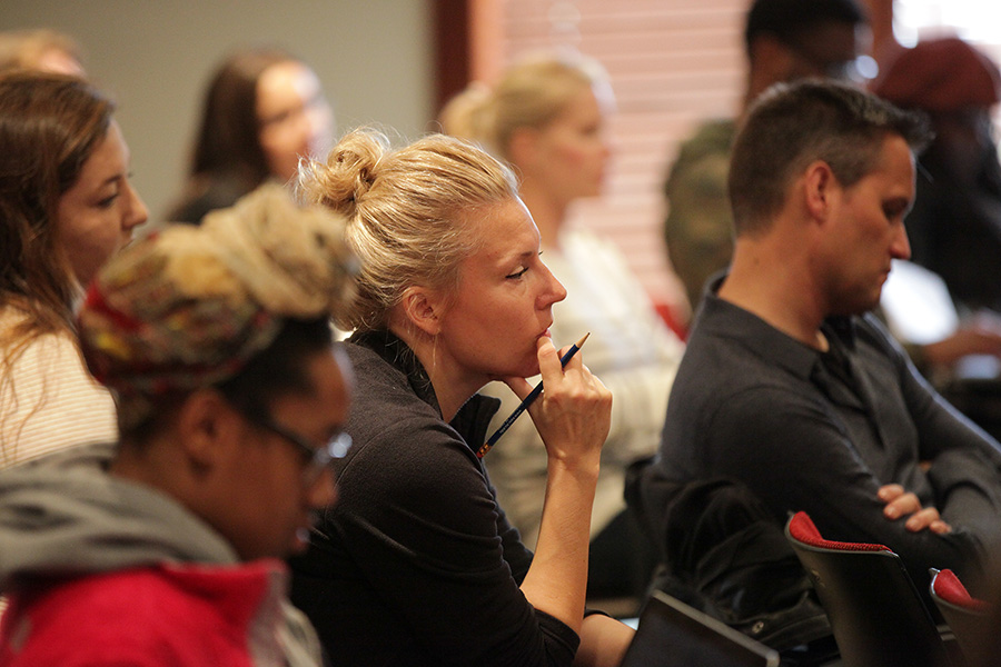 A group of people attend a lecture at the Hall Center for the Humanities