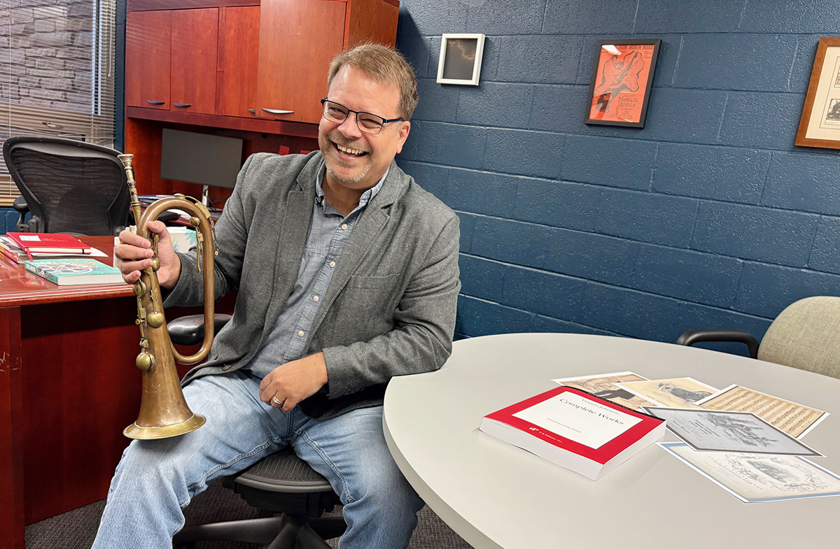 Colin Roust holds a keyed bugle