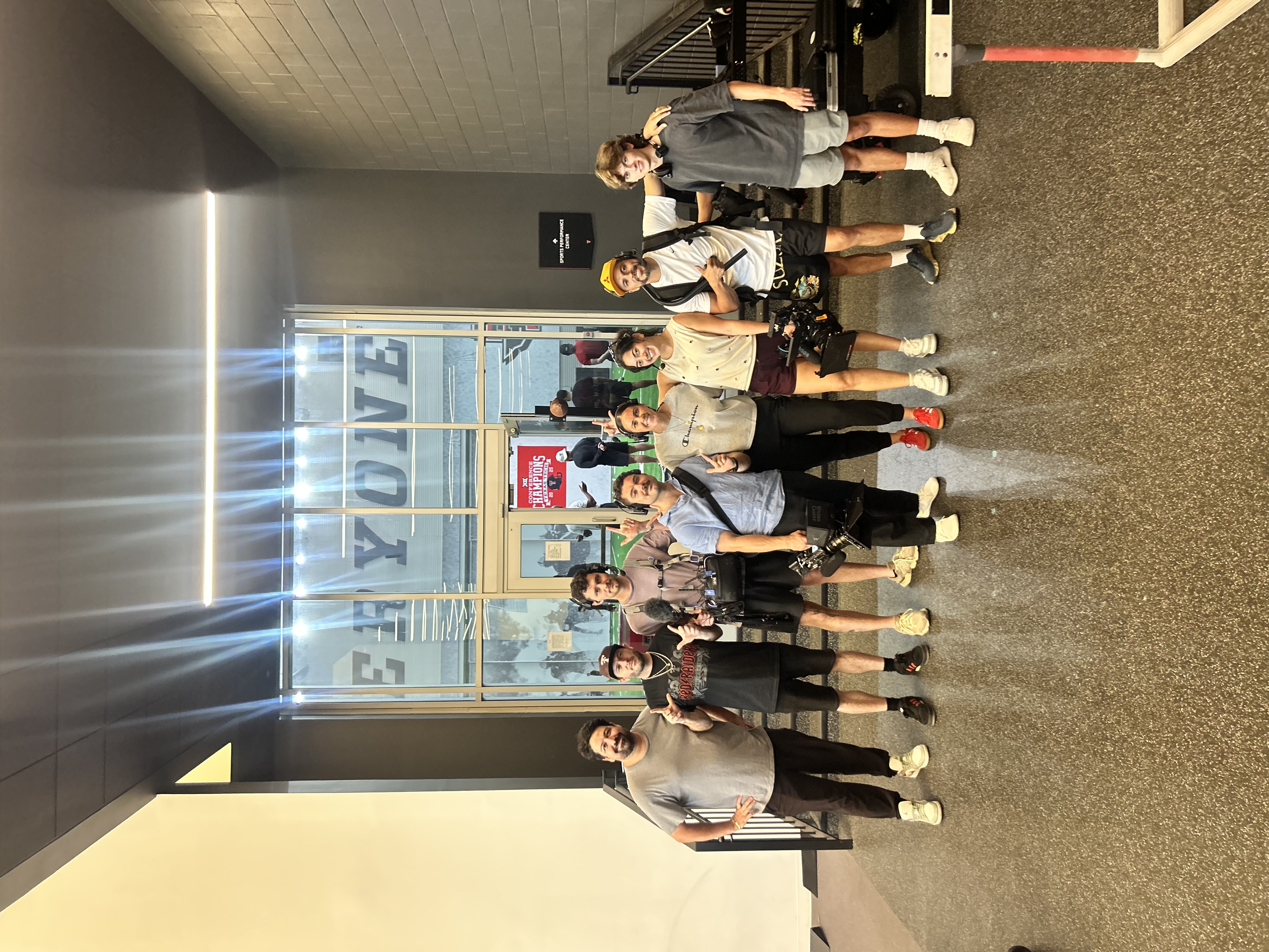 Emma Noble and seven production staff members pose for a a group photo.