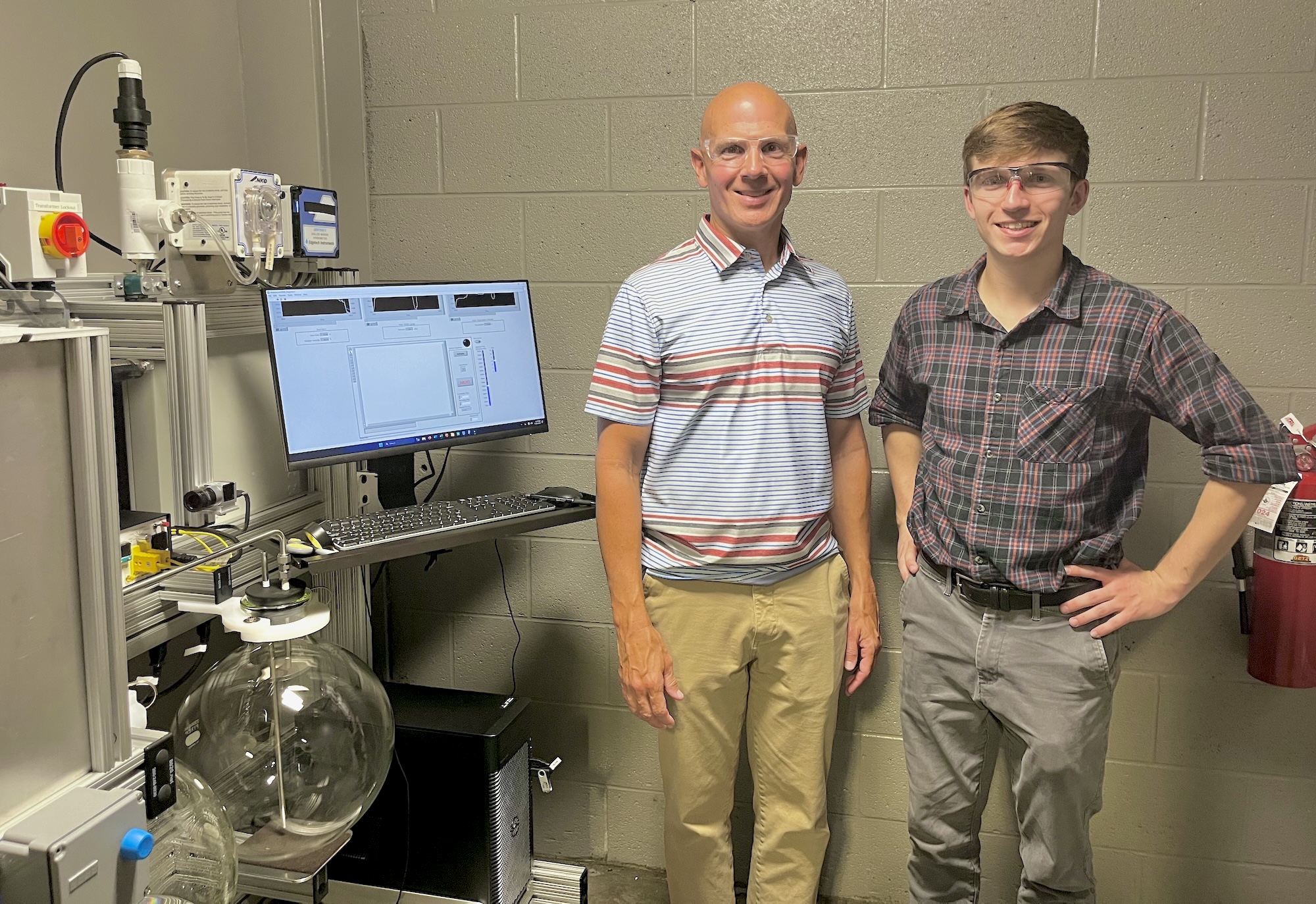 Mark Shiflett (left) and Kevin Turner led the research team that developed a more accurate testing apparatus that precisely measures the flammability of refrigerants in an effort to develop the next generation of refrigerants that are non-flammable, as well as environmentally safe.