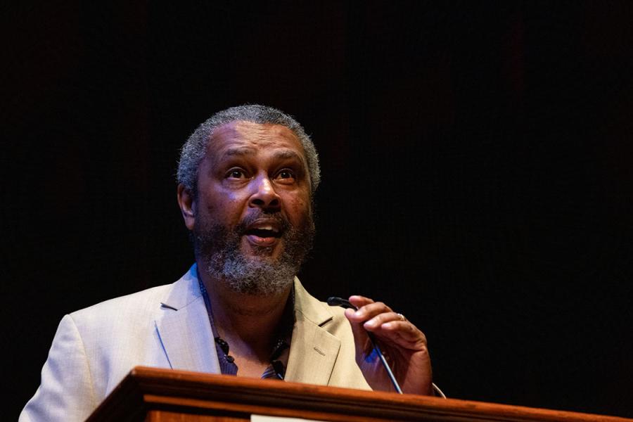 Kevin Willmott speaking at a podium.