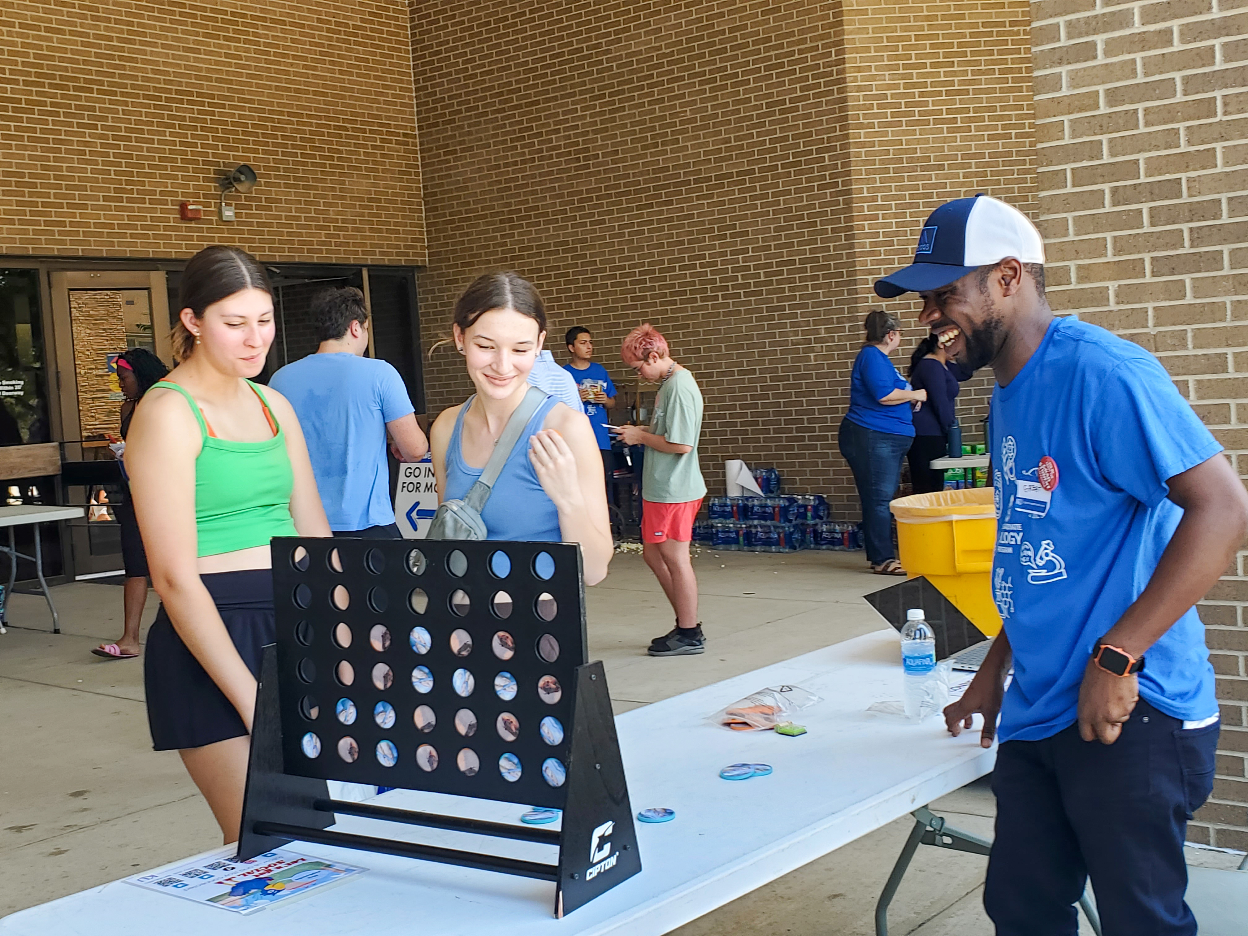 3 students play Connect 4