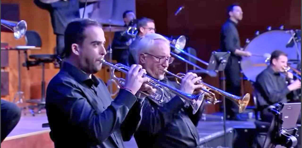 Stephen Leisring at center in March 2024 in Madrid, recording a fanfare for Spanish television Olympic coverage.