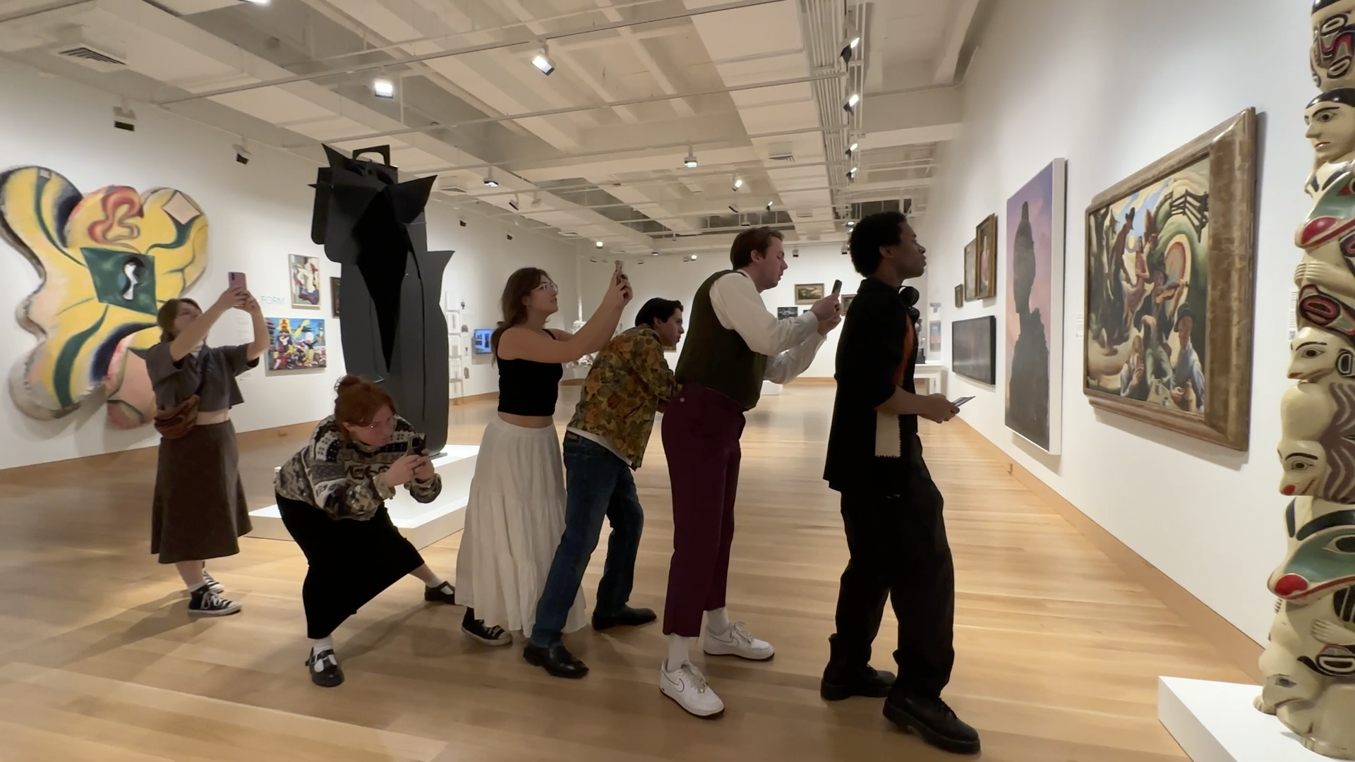 Student taking photo is Museum Gallery