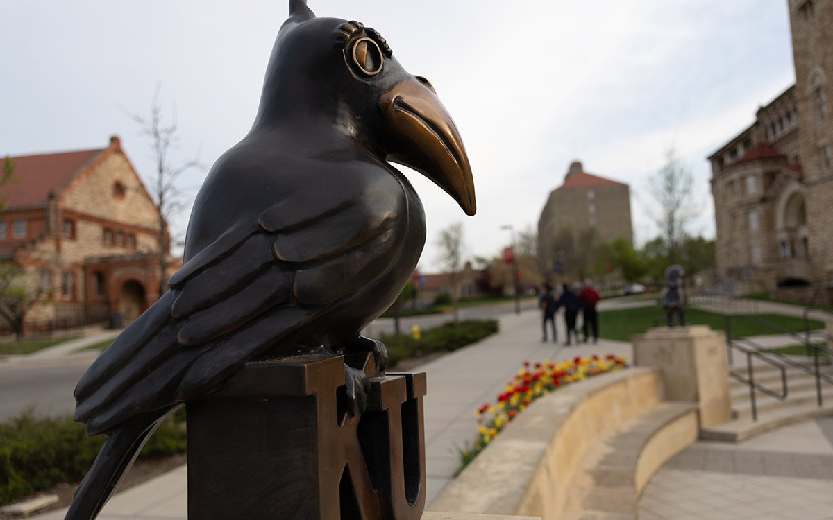 Jayhawk statue outside Kansas Union in springtime.