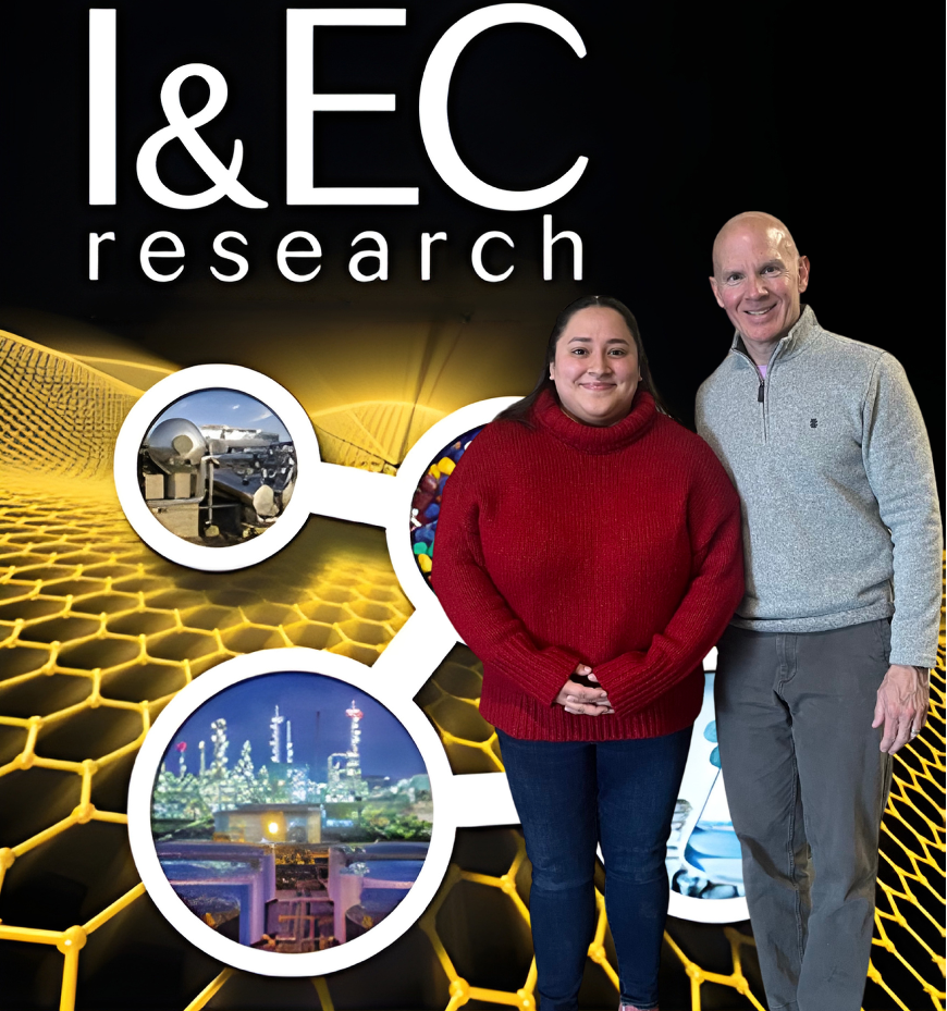 Yuniva and Mark in front of of the cover