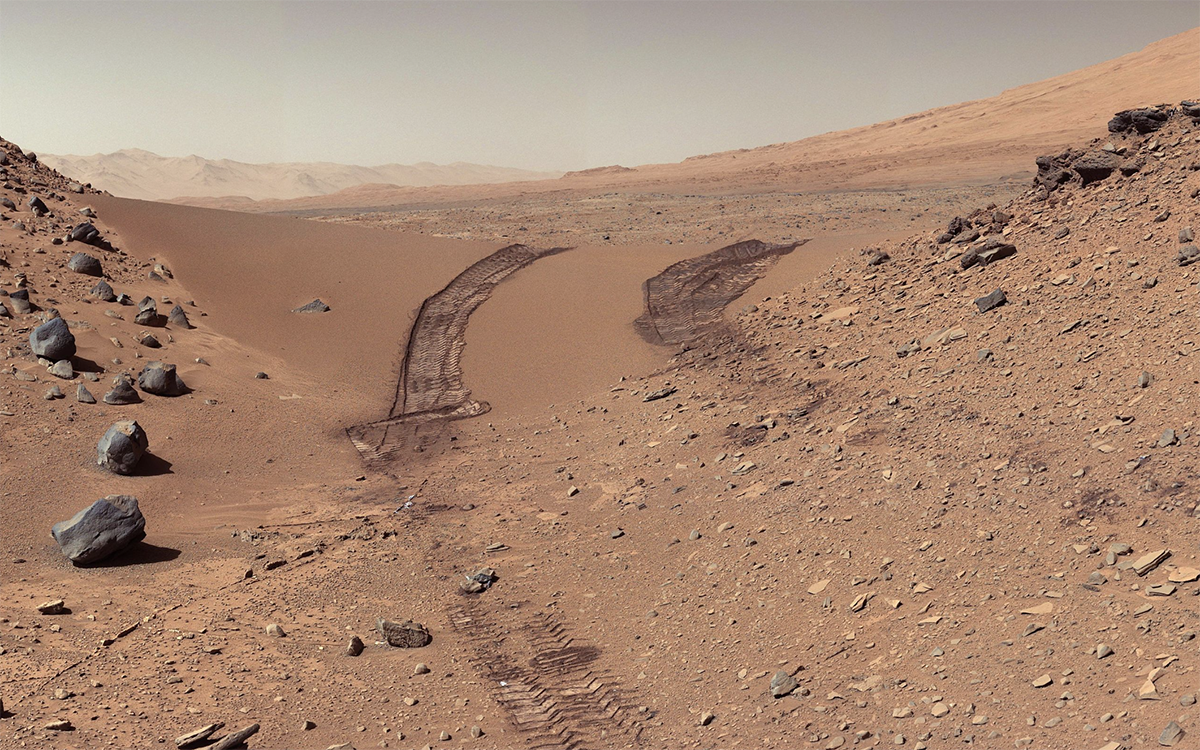 NASA Mars Curiosity's view of Martian soil and boulders after crossing the "Dingo Gap" sand dune. Photo courtesy NASA.