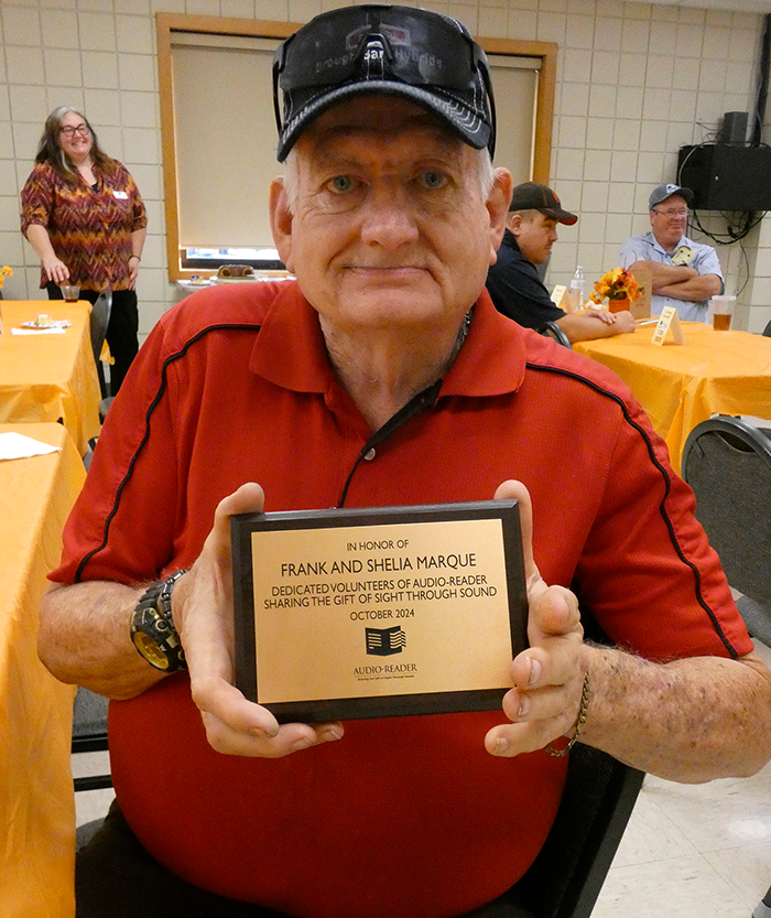 Frank Marque holds a plaque that honors his and his late wife Shelia's legacy in Pittsburg