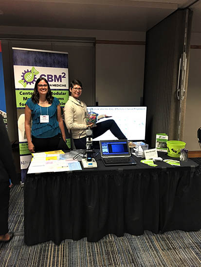 Jenny Conner and Dr. Bethany Gross show off the guessing game we had at the exhibitor booth. Everyone had fun trying to guess how many colored centrifuge tubes were in the jar!