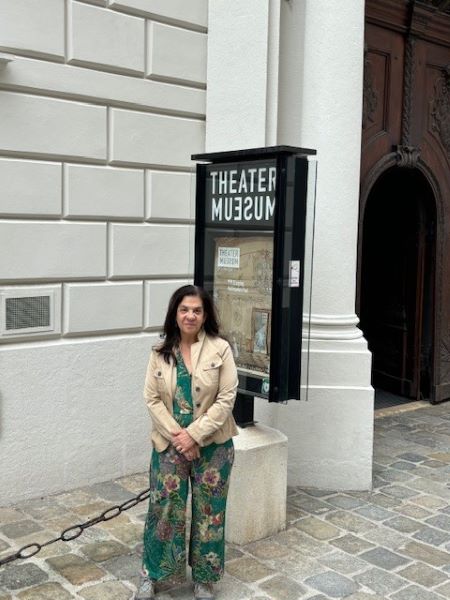 Rebecca Rovit in front of a theatre museum.
