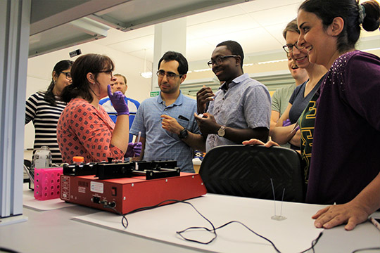 Maggie explains how the syringe pump pushes liquid through the microfluidic chip.