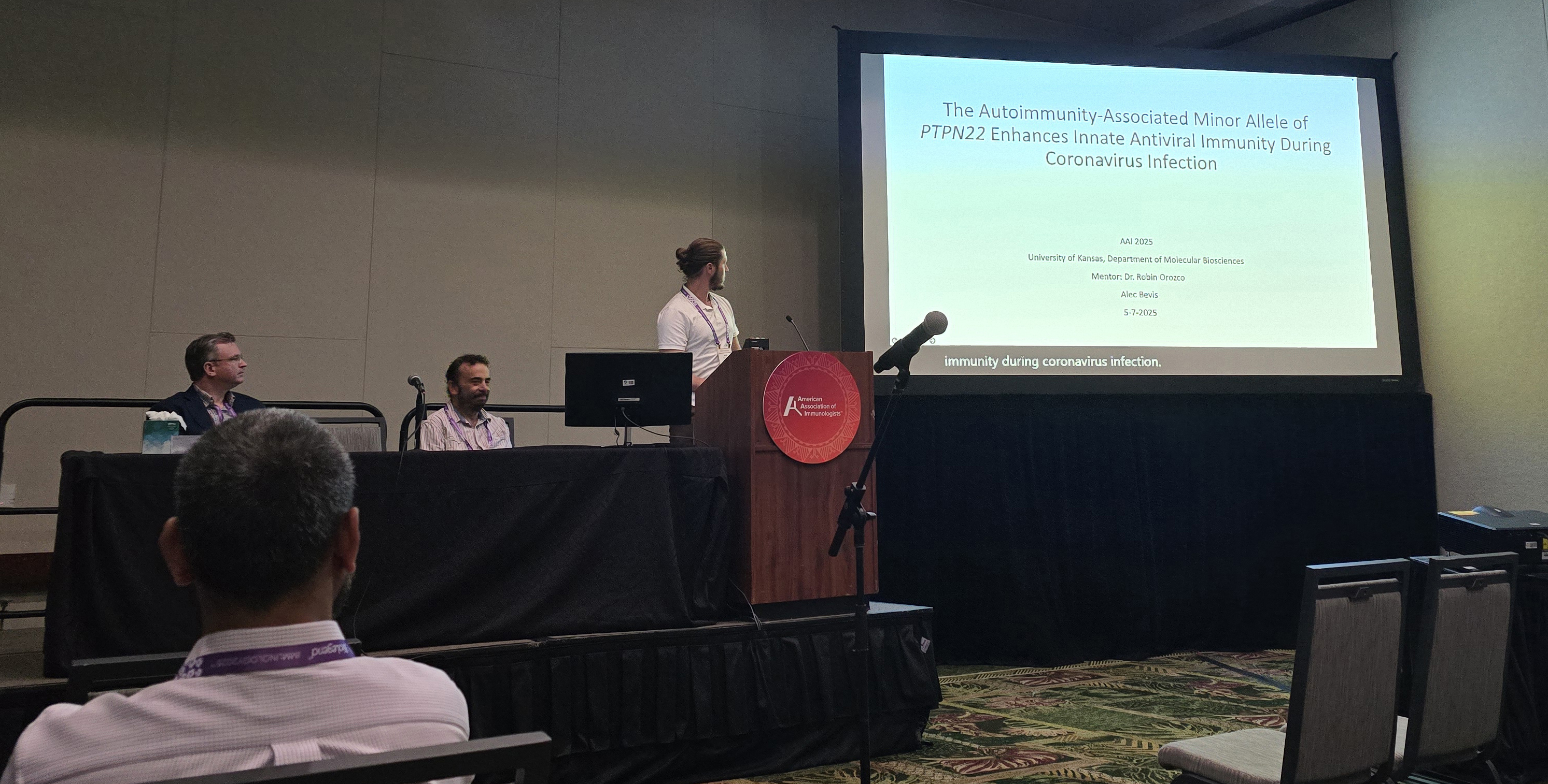 Alec Bevis presenting his research at the symposium