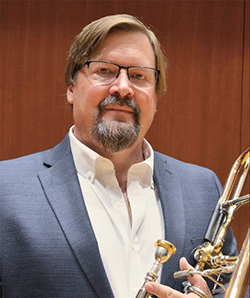 Michael Davidson holding trombone