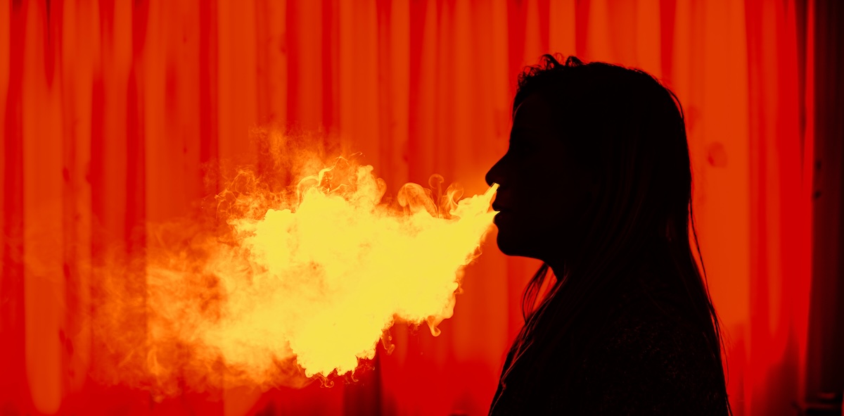 Vapor smoke being exhaled. Stock image.