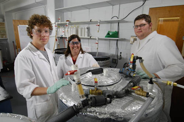 Professor Susan Williams, center, and student volunteers create biodiesel on the KU campus.