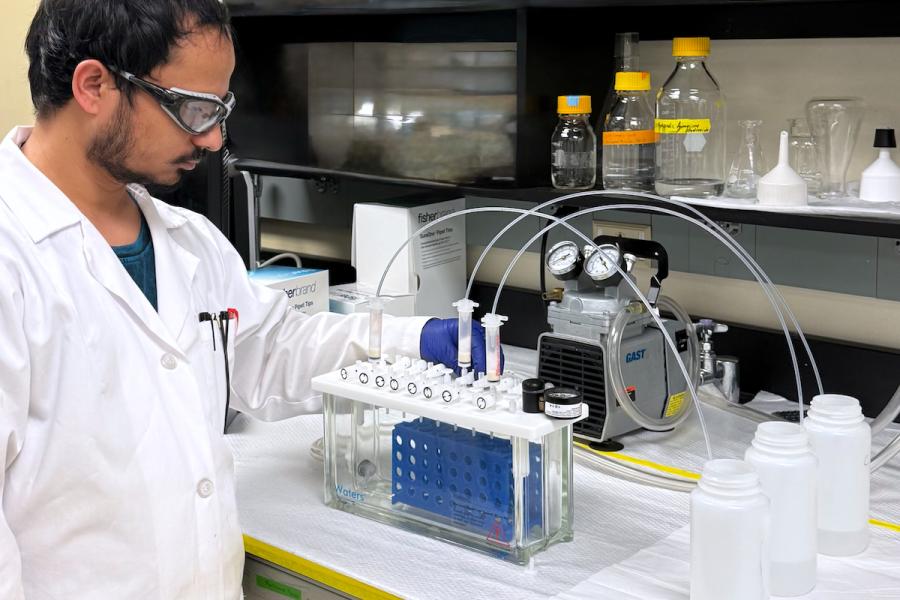 Photo of study co-author, Deepak Timalsina at work in lab.