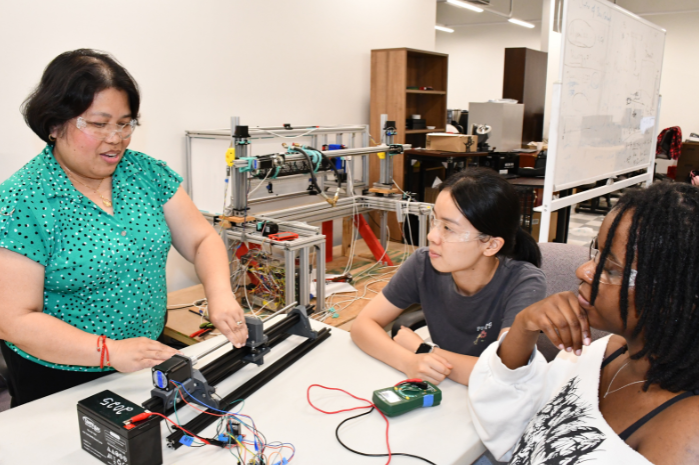 A teacher troubleshoots issues with graduate students