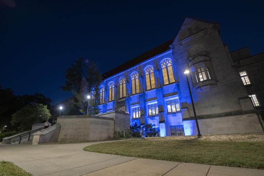 Watson Library with blue uplighting at night.