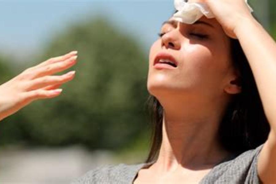 Woman suffering heat stroke